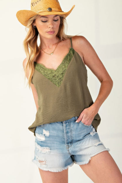 Laced Textured Poly Woven Camisole" a delicate and stylish camisole made from textured polyester fabric, featuring lace details for added elegance. It's a versatile piece suitable for layering or wearing on its own