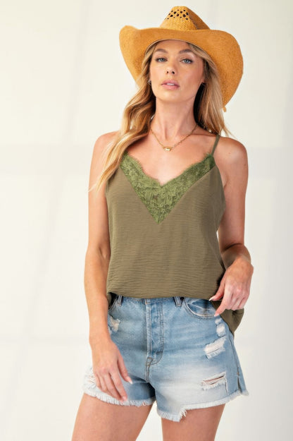 Laced Textured Poly Woven Camisole" a delicate and stylish camisole made from textured polyester fabric, featuring lace details for added elegance. It's a versatile piece suitable for layering or wearing on its own