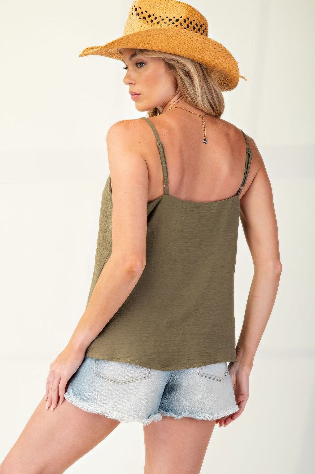 Laced Textured Poly Woven Camisole" a delicate and stylish camisole made from textured polyester fabric, featuring lace details for added elegance. It's a versatile piece suitable for layering or wearing on its own