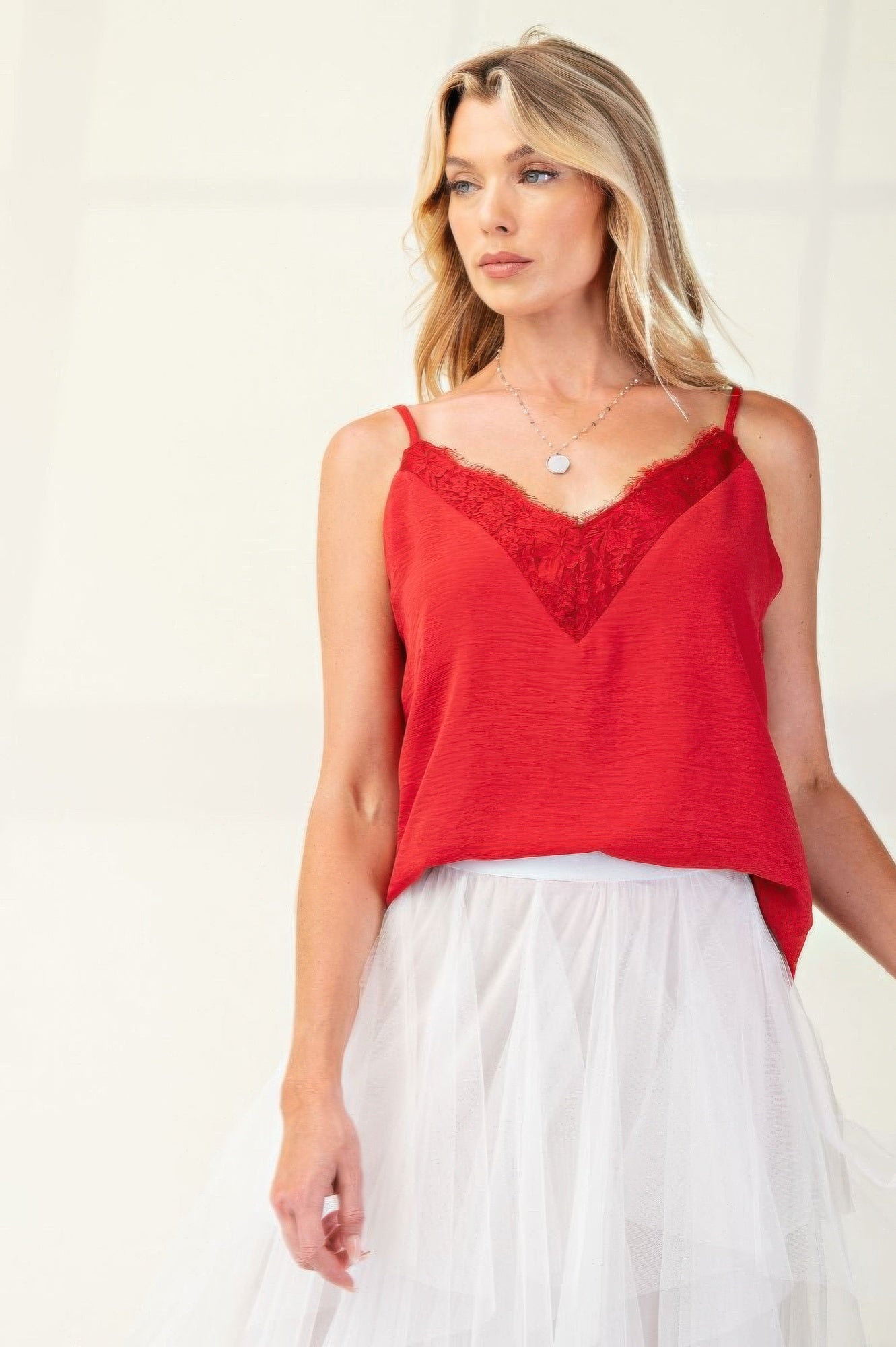 Laced Textured Poly Woven Camisole" a delicate and stylish camisole made from textured polyester fabric, featuring lace details for added elegance. It's a versatile piece suitable for layering or wearing on its own